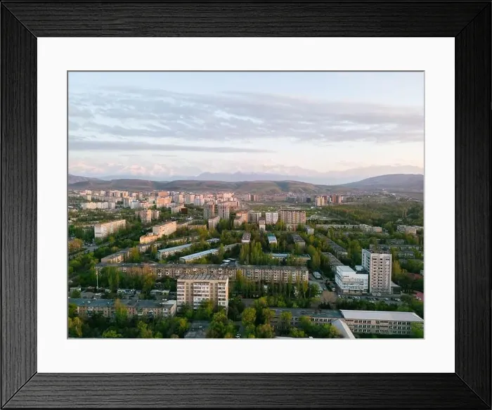 Framed Print : Aerial view of Bishkek city Kyrgyzstan with snowy mountains in the background Framed Print : Aerial view of Bishkek city Kyrgyzstan with snowy mountains in the background