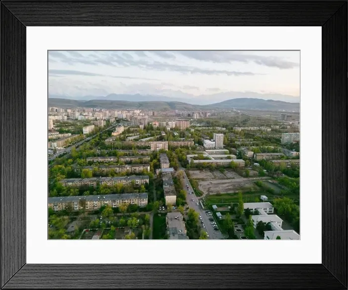 Framed Print : Aerial view of Bishkek city Kyrgyzstan with snowy mountains in the background Framed Print : Aerial view of Bishkek city Kyrgyzstan with snowy mountains in the background