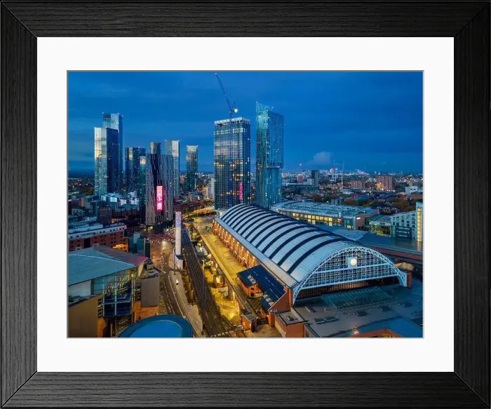 Framed Print : Manchester City Centre skyline at dawn with city lights and dark skies of this English city Framed Print : Manchester City Centre skyline at dawn with city lights and dark skies of this English city
