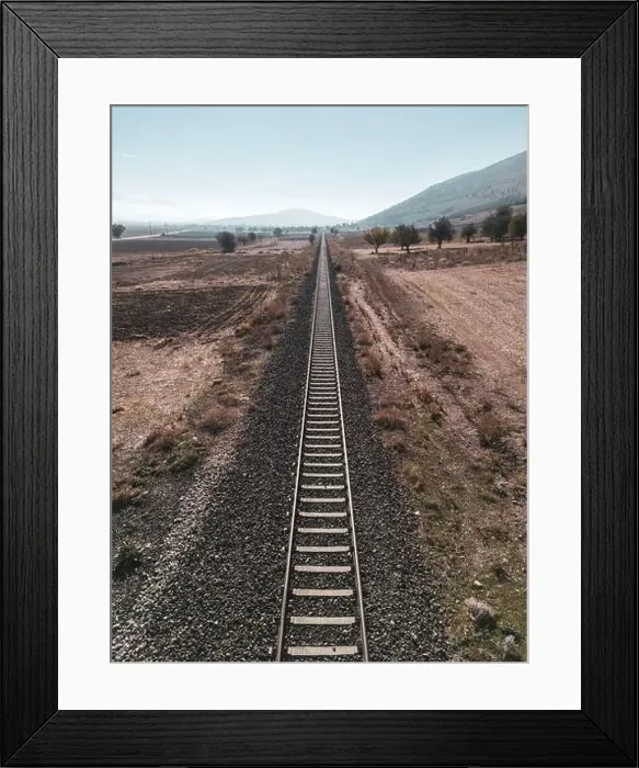 Framed Print : Top view of the train track passing through the arid land, taken with a drone Framed Print : Top view of the train track passing through the arid land, taken with a drone