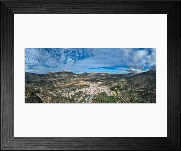 Framed Print : aerial view of the pretty white village of Alfarnate in the province of Malaga, Spain Framed Print : aerial view of the pretty white village of Alfarnate in the province of Malaga, Spain