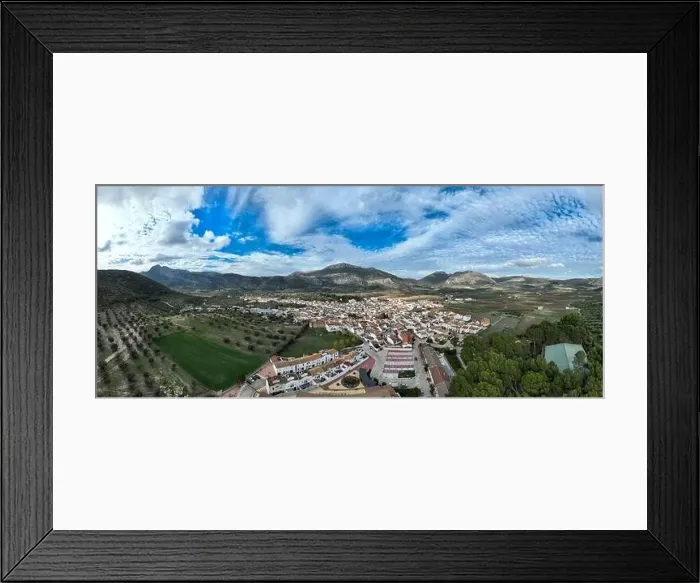Framed Print : aerial view of the pretty white village of Alfarnate in the province of Malaga, Spain Framed Print : aerial view of the pretty white village of Alfarnate in the province of Malaga, Spain