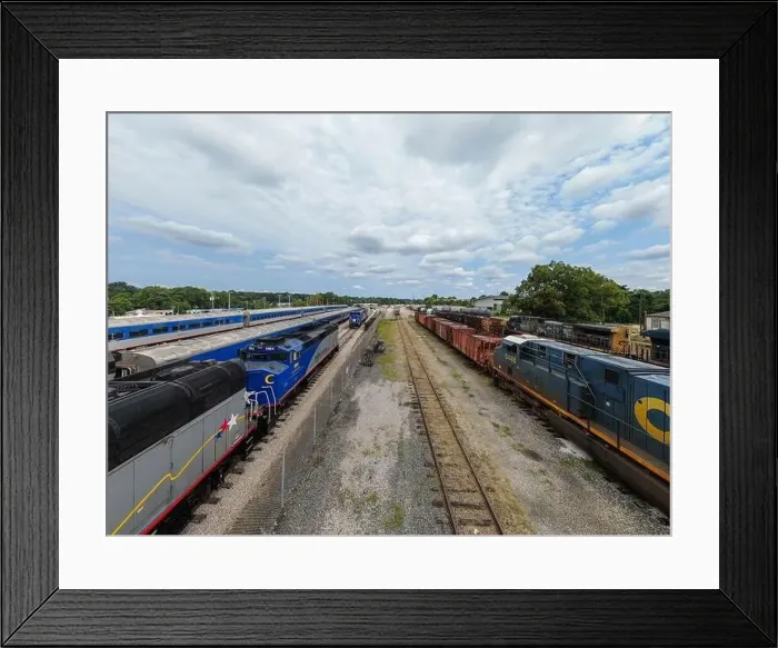 Framed Print : drone photos of various rail cars and amtrak trains on a cloudy day in downtown raleigh north carolina Framed Print : drone photos of various rail cars and amtrak trains on a cloudy day in downtown raleigh north carolina