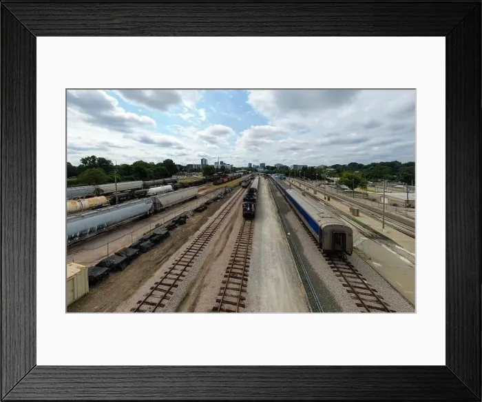 Framed Print : drone photos of various rail cars and amtrak trains on a cloudy day in downtown raleigh north carolina Framed Print : drone photos of various rail cars and amtrak trains on a cloudy day in downtown raleigh north carolina