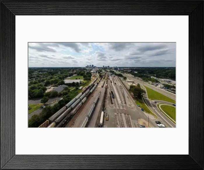 Framed Print : drone photos of various rail cars and amtrak trains on a cloudy day in downtown raleigh north carolina Framed Print : drone photos of various rail cars and amtrak trains on a cloudy day in downtown raleigh north carolina
