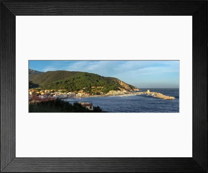 Framed Print : A panorama view of the town and harbour of Marciana Marina on Elba Island