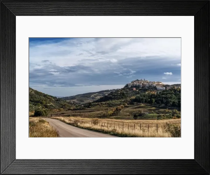 Framed Print : A view of the town of Tolve in Basilicata with a country highway in the foreground Framed Print : A view of the town of Tolve in Basilicata with a country highway in the foreground