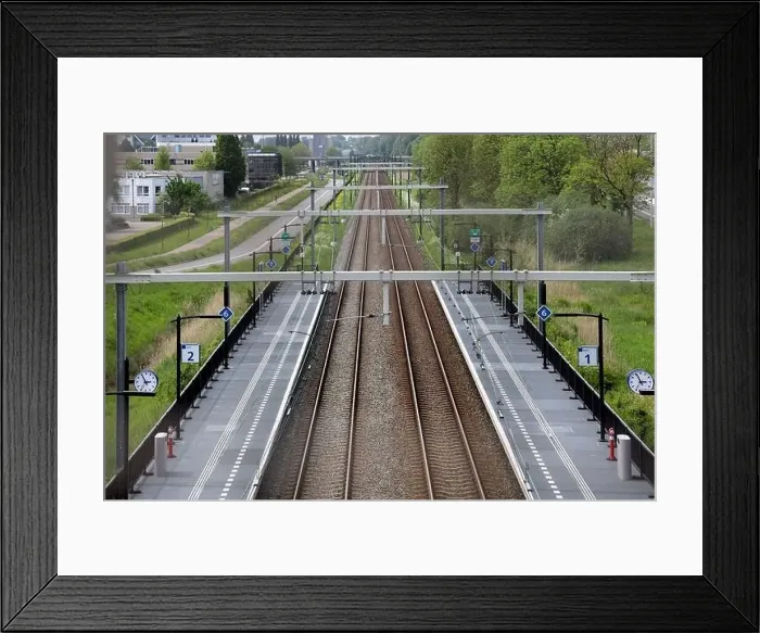 Framed Print : Railroad track and platforms of Lansingerland Zoetermeer Railway Station in the Netherlands Framed Print : Railroad track and platforms of Lansingerland Zoetermeer Railway Station in the Netherlands