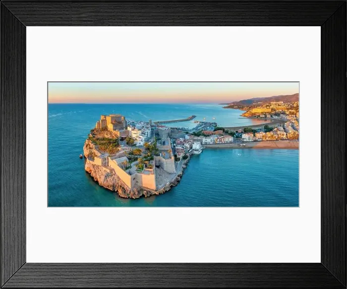 Framed Print : Panoramic view of Peniscola during sunrise, a coastal town in eastern Spain, Costa del Azahar, Province Castello, Spain Framed Print : Panoramic view of Peniscola during sunrise, a coastal town in eastern Spain, Costa del Azahar, Province Castello, Spain