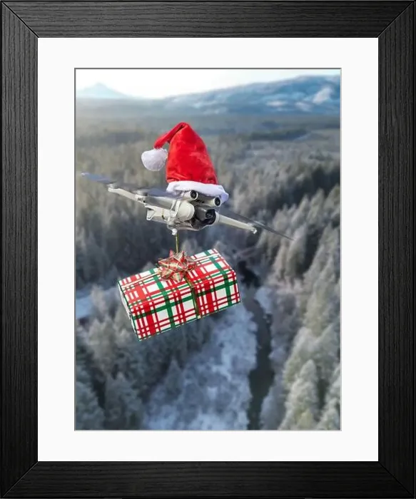 Framed Print : Drone concept wearing a santa hat and holding a wrapped gift out for delivery isolated over a rural landscape Framed Print : Drone concept wearing a santa hat and holding a wrapped gift out for delivery isolated over a rural landscape