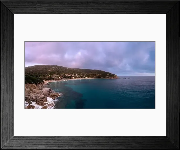 Framed Print : A drone view of Cavoli Beach on Elba Island just after sunset with a misty purple sky Framed Print : A drone view of Cavoli Beach on Elba Island just after sunset with a misty purple sky