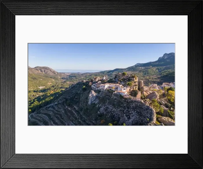 Framed Print : Aerial drone photo of the Spanish mountain town named El Castell de Guadalest Framed Print : Aerial drone photo of the Spanish mountain town named El Castell de Guadalest