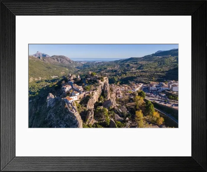 Framed Print : Aerial drone photo of the Spanish mountain town named El Castell de Guadalest Framed Print : Aerial drone photo of the Spanish mountain town named El Castell de Guadalest