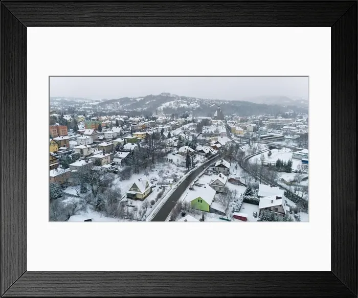 Framed Print : Drone shot of a small town named Limanowa in mountains in Poland covered with fog and snow Framed Print : Drone shot of a small town named Limanowa in mountains in Poland covered with fog and snow