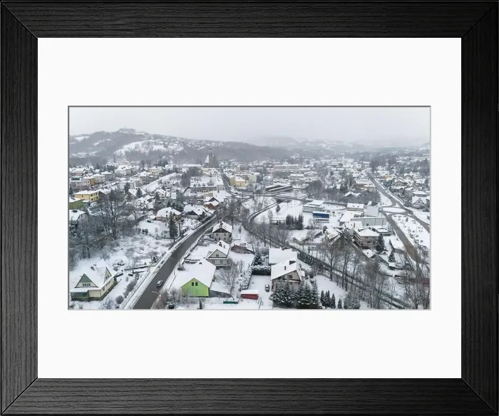 Framed Print : Drone shot of a small town named Limanowa in mountains in Poland covered with fog and snow Framed Print : Drone shot of a small town named Limanowa in mountains in Poland covered with fog and snow