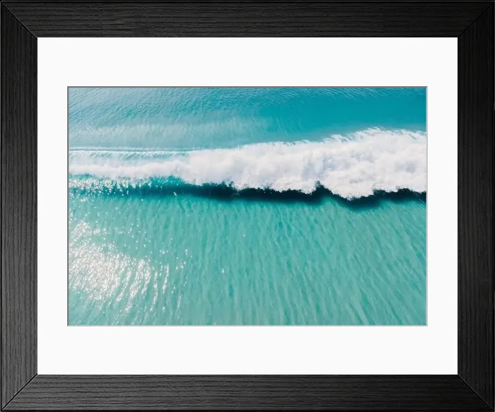 Framed Print : Blue clear ocean and surfing wave. Surfing waves in tropics. Aerial view Framed Print : Blue clear ocean and surfing wave. Surfing waves in tropics. Aerial view