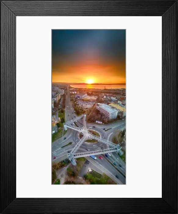 Framed Print : Panorama view of the road with a circular motion and a flower bed at sunset. Aerial photography Framed Print : Panorama view of the road with a circular motion and a flower bed at sunset. Aerial photography