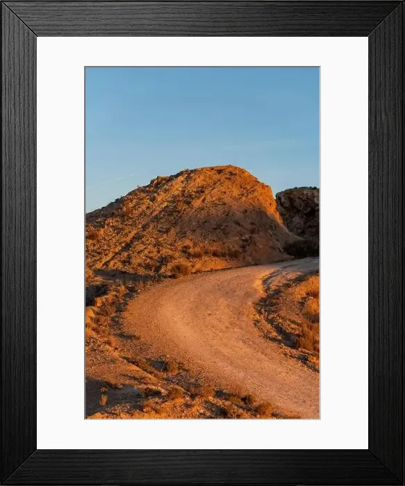 Framed Print : Dirt road in arid desert landscape with distant cliffs over sunset, Elche, Alicante province, Spain - Stock photo Framed Print : Dirt road in arid desert landscape with distant cliffs over sunset, Elche, Alicante province, Spain - Stock photo