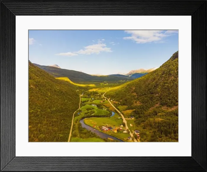 Framed Print : Winding road and a village in a high valley in Norway, clouds and high mountains. Taiga and arctic feeling Framed Print : Winding road and a village in a high valley in Norway, clouds and high mountains. Taiga and arctic feeling