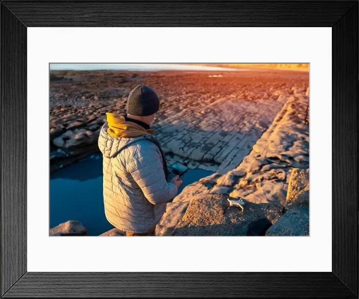 Framed Print : Bearded man using a drone with remote controller making photos and videos, having fun with new technology trends Framed Print : Bearded man using a drone with remote controller making photos and videos, having fun with new technology trends