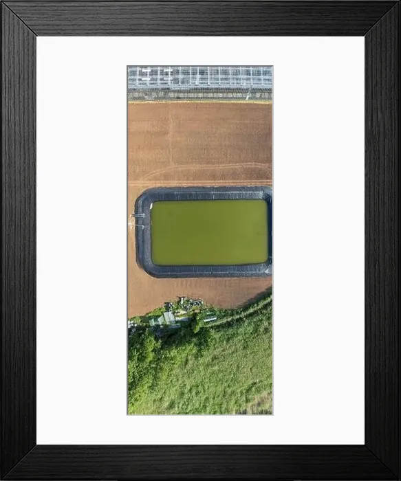 Framed Print : Glass greenhouses from above in sunny weather Framed Print : Glass greenhouses from above in sunny weather