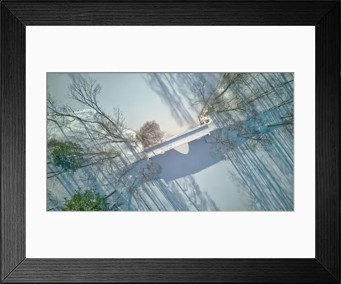 Framed Print : Aerial view of the bridge in the park, frozen pond, long shadow of trees, beautiful winter scenery Framed Print : Aerial view of the bridge in the park, frozen pond, long shadow of trees, beautiful winter scenery