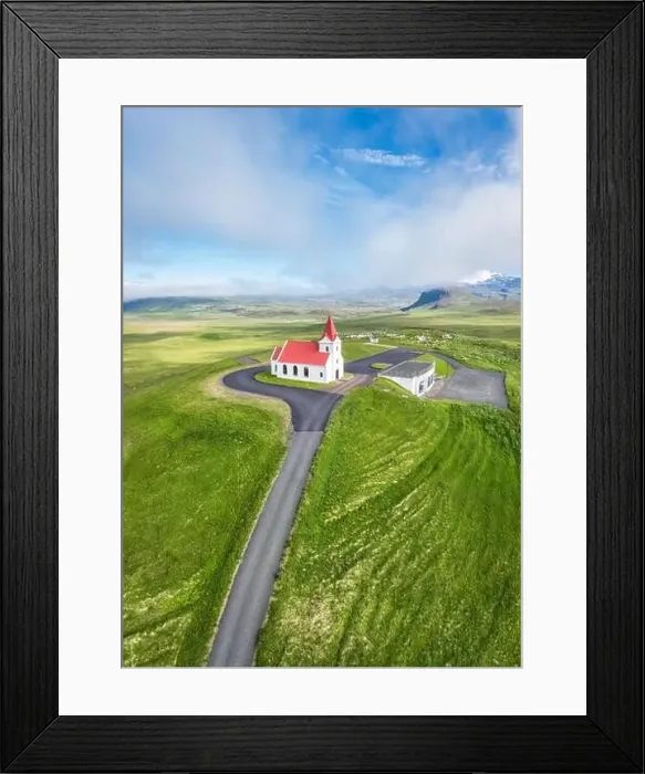 Framed Print : Aerial view of beautiful holy Ingjaldsholskirkja church on hill among the meadow Framed Print : Aerial view of beautiful holy Ingjaldsholskirkja church on hill among the meadow