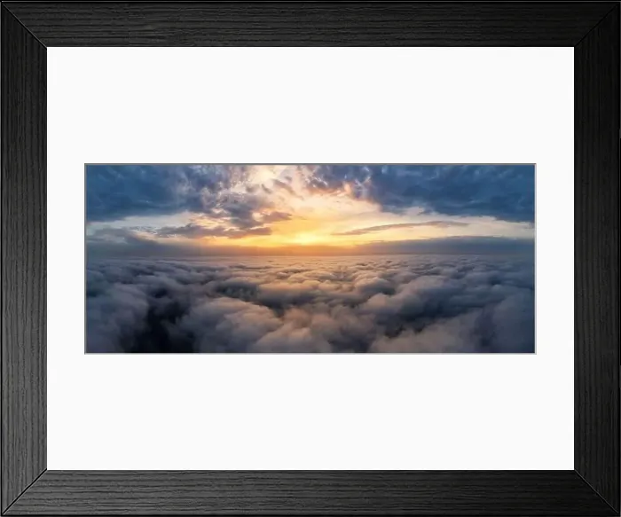 Framed Print : Beautiful dramatic sunset sky above fluffy clouds early in the morning. Drone view Framed Print : Beautiful dramatic sunset sky above fluffy clouds early in the morning. Drone view