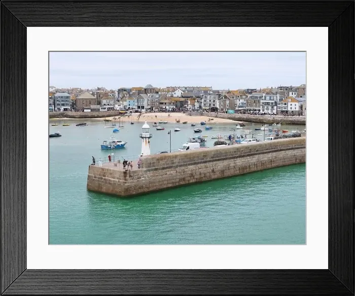 Framed Print : Lighthouse on harbour wall St Ives Cornwall on calm summers day drone, aerial Framed Print : Lighthouse on harbour wall St Ives Cornwall on calm summers day drone, aerial