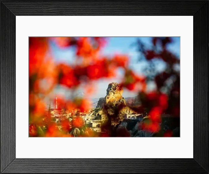 Framed Print : View of the Ortahisar Castle in between the red leaves in Cappadocia Framed Print : View of the Ortahisar Castle in between the red leaves in Cappadocia