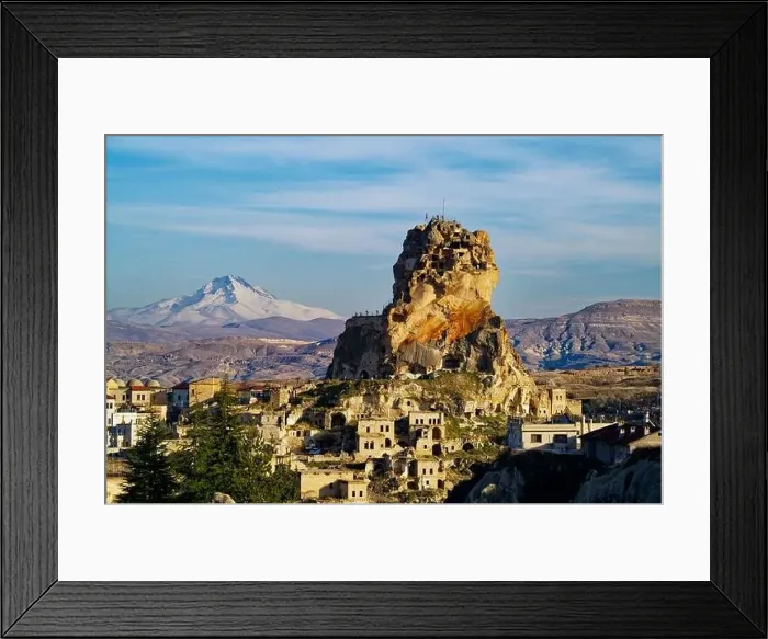 Framed Print : Vew of the Ortahisar Castle in Cappadocia, Turkey with the snow capped Mount Erciyes in the background Framed Print : Vew of the Ortahisar Castle in Cappadocia, Turkey with the snow capped Mount Erciyes in the background
