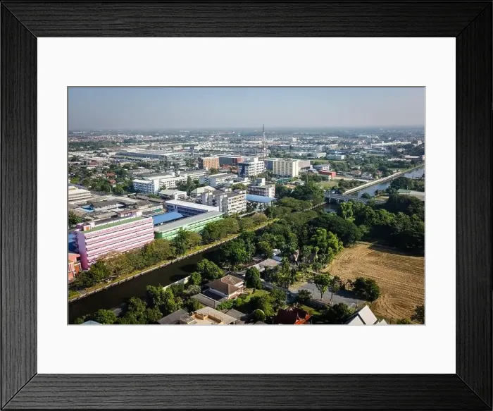 Framed Print : This aerial photograph captures a city surrounded by a river
