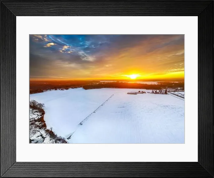 Framed Print : Sunrise at the farm with irrigation equipment on frozen field and barn house Framed Print : Sunrise at the farm with irrigation equipment on frozen field and barn house