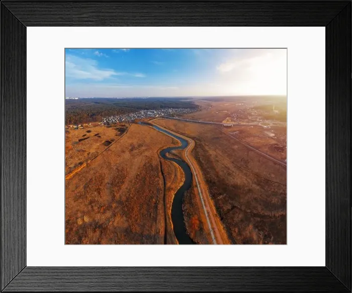 Framed Print : Winding river in field with dry grass. Autumn landscape from aerial view Framed Print : Winding river in field with dry grass. Autumn landscape from aerial view