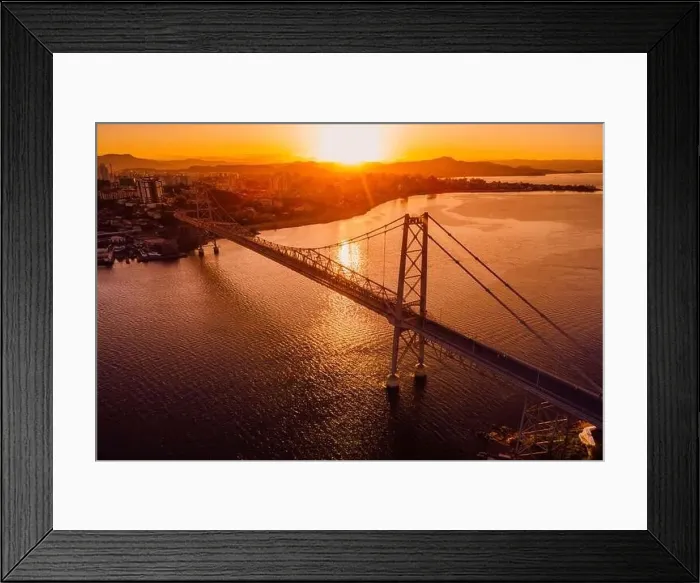 Framed Print : Hercilio luz bridge with warm sunset in Florianopolis, Brazil. Aerial view Framed Print : Hercilio luz bridge with warm sunset in Florianopolis, Brazil. Aerial view