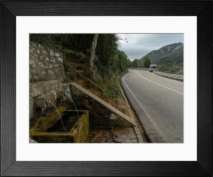Framed Print : A camper van parked on a mountain highway in the backcountry with a fresh natural spring water fountain in Framed Print : A camper van parked on a mountain highway in the backcountry with a fresh natural spring water fountain in