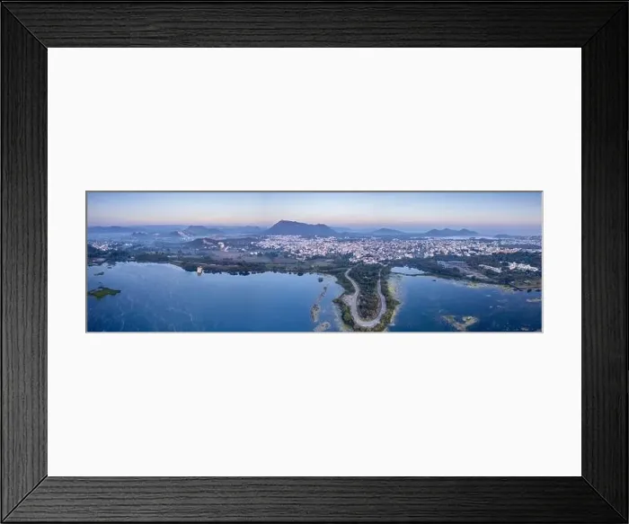 Framed Print : Panoramic aerial drone shot at dawn dusk with road loop extending into fateh sagar lake with aravalli hills in distance Framed Print : Panoramic aerial drone shot at dawn dusk with road loop extending into fateh sagar lake with aravalli hills in distance