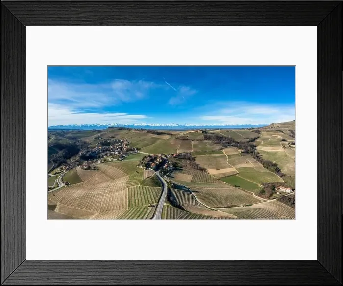 Framed Print : The hilly countryside in the Italian Piedmont with the village of Barolo and snow-covered mountains behind Framed Print : The hilly countryside in the Italian Piedmont with the village of Barolo and snow-covered mountains behind