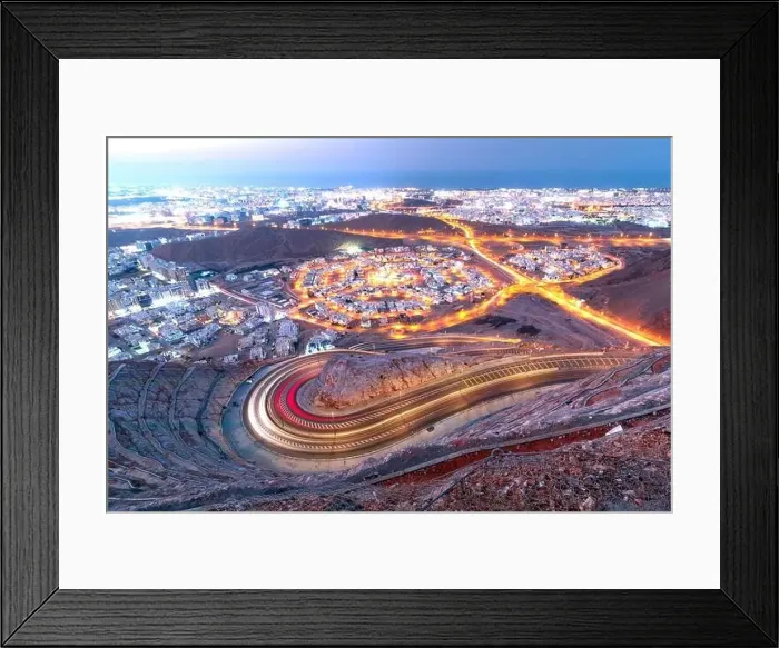 Framed Print : View from Amirat view point on wavy road in Muscat at blue hour time Framed Print : View from Amirat view point on wavy road in Muscat at blue hour time