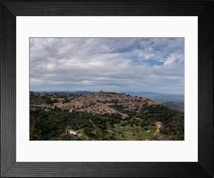 Framed Print : Drone view of the Tuscan hilltop village and wine capital of Montalcino Framed Print : Drone view of the Tuscan hilltop village and wine capital of Montalcino