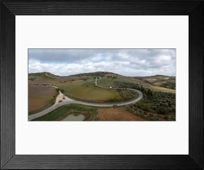 Framed Print : Long winding road leading to the Tuscan hilltop village of Pienza Framed Print : Long winding road leading to the Tuscan hilltop village of Pienza
