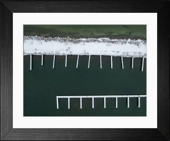 Framed Print : Winter afternoon aerial images of docks in Lansing, NY, on the east side of Cayuga Lake Framed Print : Winter afternoon aerial images of docks in Lansing, NY, on the east side of Cayuga Lake