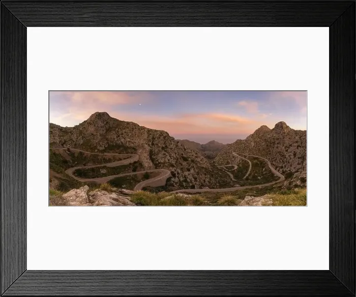 Framed Print : panorama sunrise landscape in the Tramuntana mountains of Mallorca with a view of the landmark snake road leading down Framed Print : panorama sunrise landscape in the Tramuntana mountains of Mallorca with a view of the landmark snake road leading down