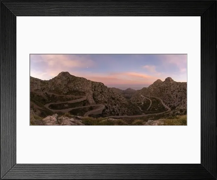 Framed Print : panorama sunrise landscape in the Tramuntana mountains of Mallorca with a view of the landmark snake road leading down Framed Print : panorama sunrise landscape in the Tramuntana mountains of Mallorca with a view of the landmark snake road leading down