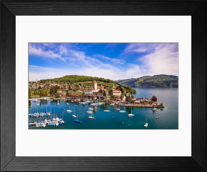 Framed Print : Canton Bern in Switzerland. aerial drone panorama of lake Thun and the Spiez village with medieval castle and old town Framed Print : Canton Bern in Switzerland. aerial drone panorama of lake Thun and the Spiez village with medieval castle and old town