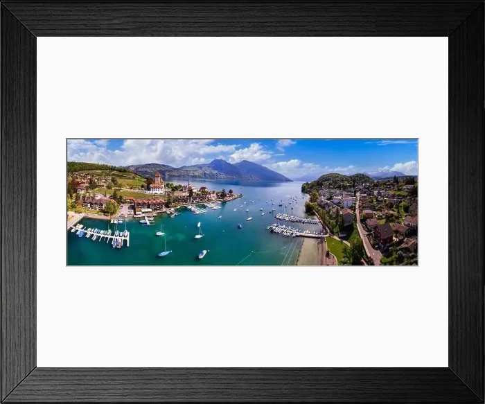 Framed Print : Switzerland. aerial drone panorama of lake Thun and the Spiez village with medieval castle and old town. cantone Bern Framed Print : Switzerland. aerial drone panorama of lake Thun and the Spiez village with medieval castle and old town. cantone Bern