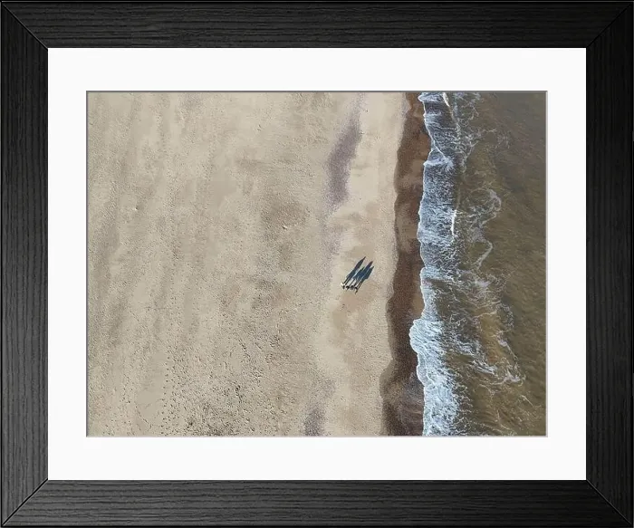 Framed Print : Overhead birds eye drone aerial view people walking on beach long shadows Great Yarmouth beach Framed Print : Overhead birds eye drone aerial view people walking on beach long shadows Great Yarmouth beach