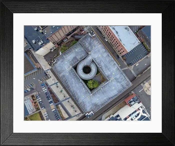 Framed Print : Elmira, NY, USA - 03-02-2024 - Winter aerial image of the downtown parking garage in the City of Elmira Framed Print : Elmira, NY, USA - 03-02-2024 - Winter aerial image of the downtown parking garage in the City of Elmira
