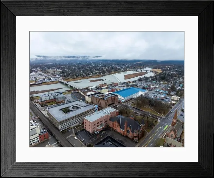 Framed Print : Elmira, NY, USA - 03-02-2024 - Cloudy winter aerial image of the downtown area in the City of Elmira Framed Print : Elmira, NY, USA - 03-02-2024 - Cloudy winter aerial image of the downtown area in the City of Elmira