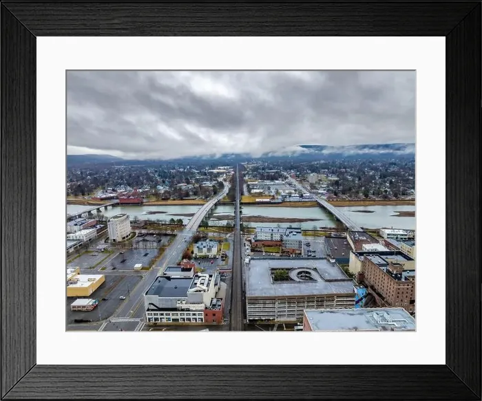 Framed Print : Elmira, NY, USA - 03-02-2024 - Cloudy winter aerial image of the downtown area in the City of Elmira Framed Print : Elmira, NY, USA - 03-02-2024 - Cloudy winter aerial image of the downtown area in the City of Elmira